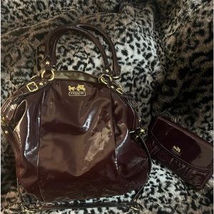 Coach woman bag and matching wallet has a unique shape.